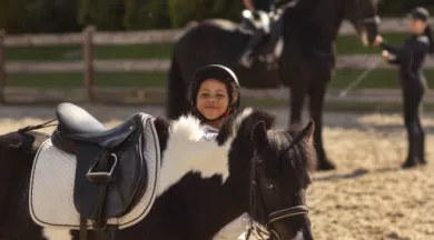 full-shot-children-learning-ride-horses  - Freepik